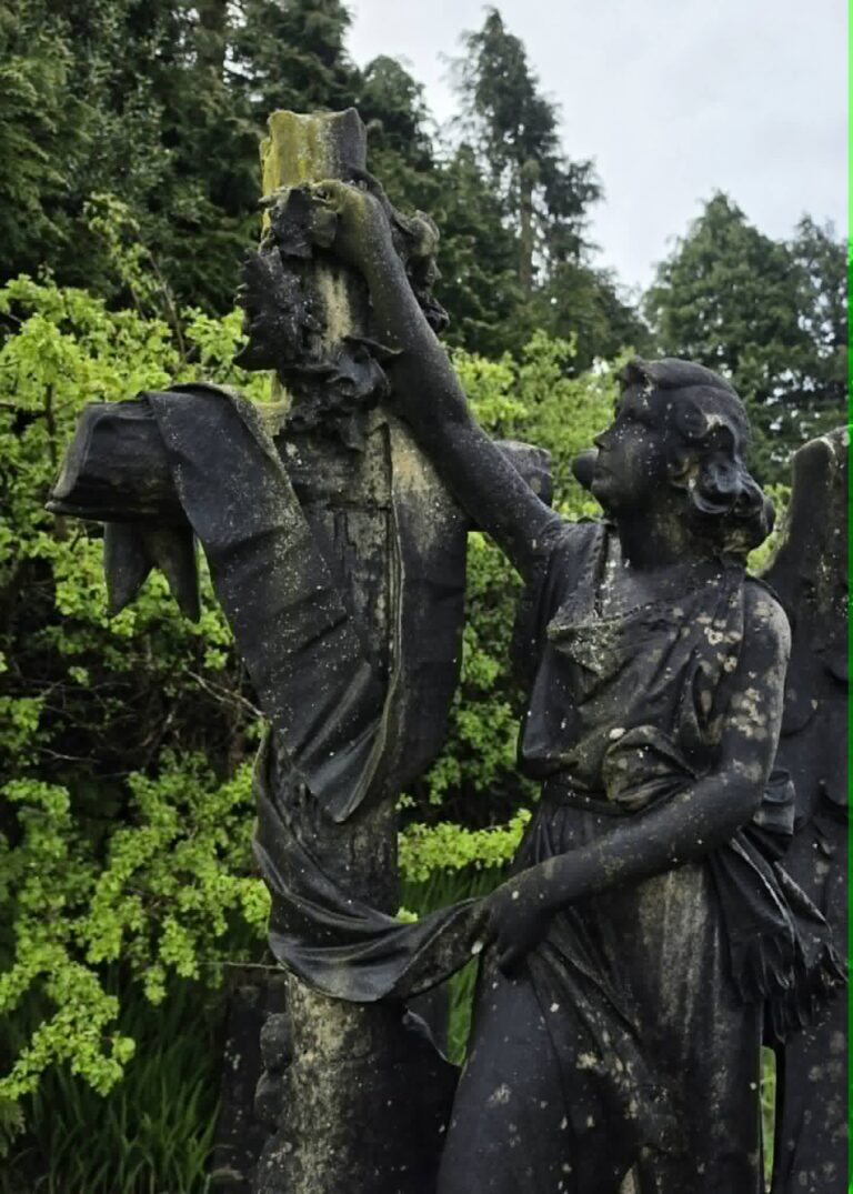 Memorial statue before grave cleaning